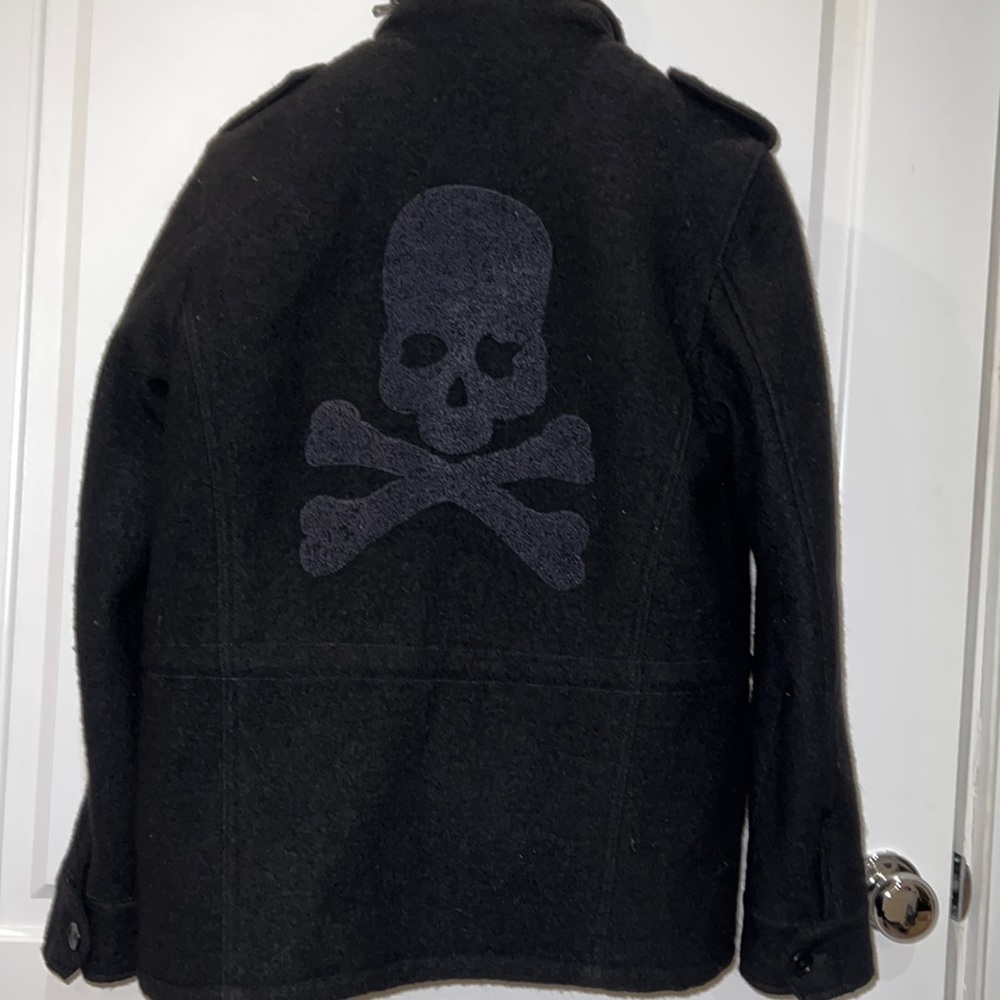 Wool boucle unisex jacket in black with skull